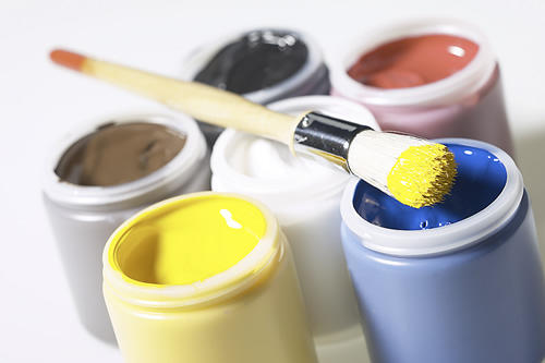 paint cans with a paint brush