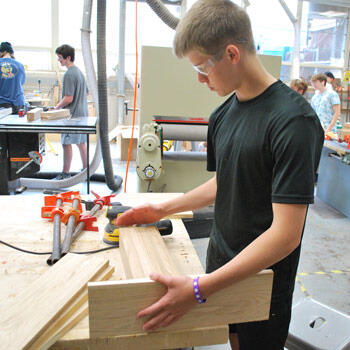 Student joining boards in a woodworking class