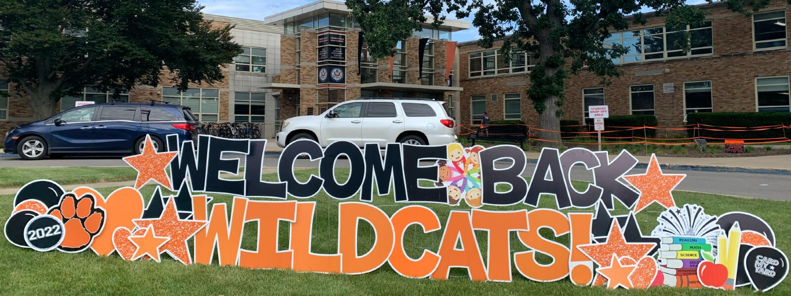 Welcome Back Wildcats sign on the lawn in front of LHS